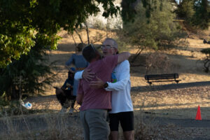 two runners hugging