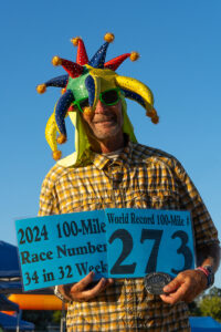 runner holding world record sign